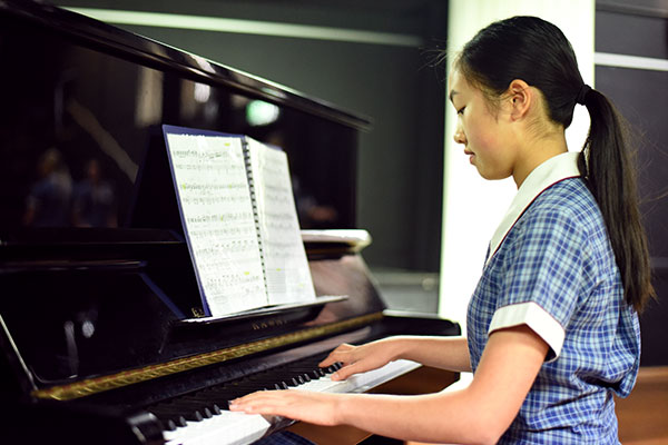 St Patrick's College Sutherland - student playing the piano