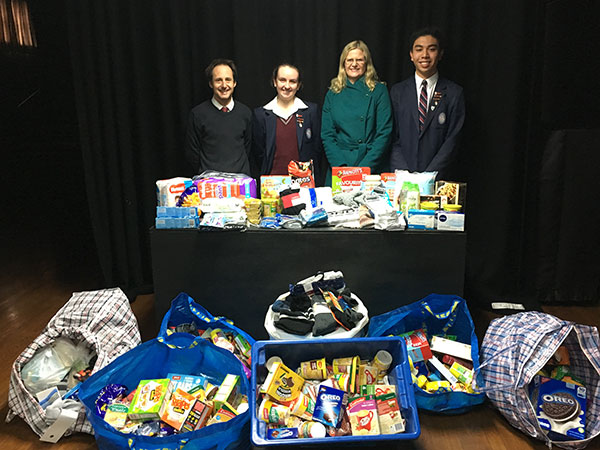 St Patrick's College Sutherland - students and teachers with hampers of food donations