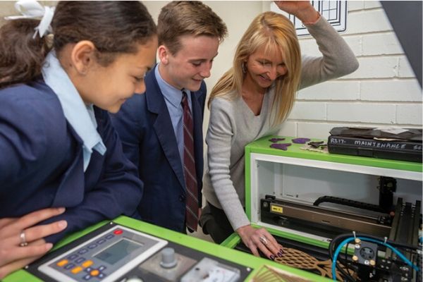 St Patricks College Sutherland - 2 students interacting with teacher and 3D printer